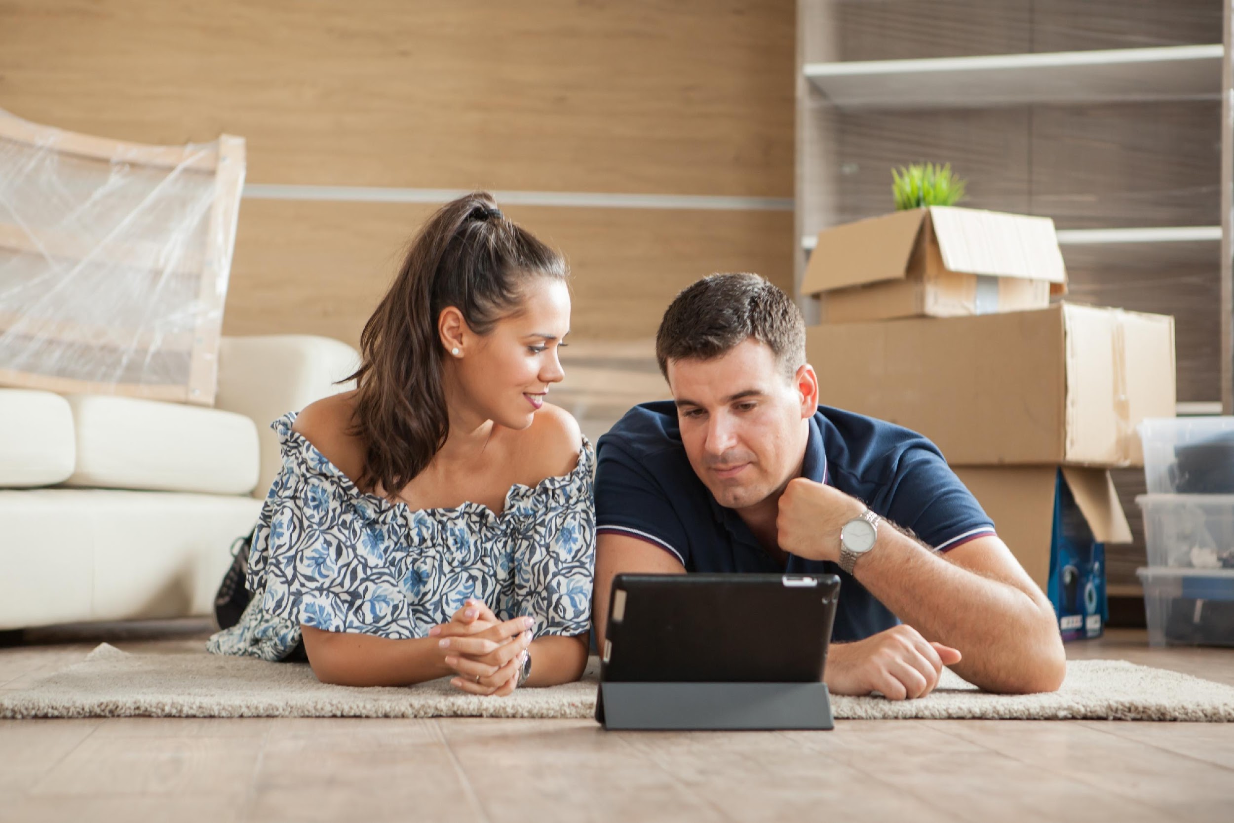 Generic white couple looking at laptop