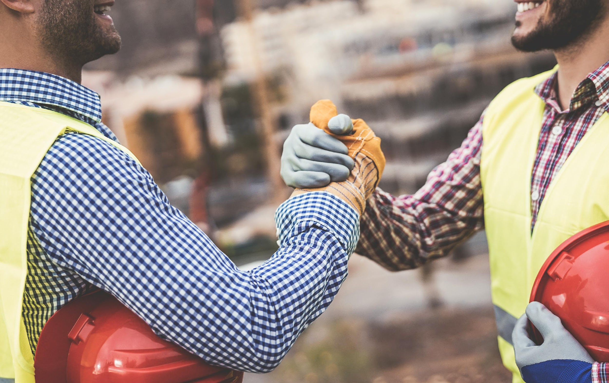 construction workers shaking hands